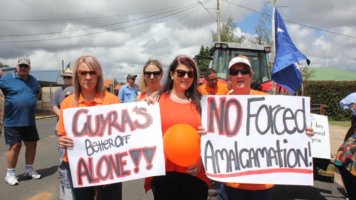 AGAINST AMALGAMATION: Tara Mendes, Katrina Rolff, and Debbie Mendes at an anti-amalgamation rally in Guyra in 2017. Photo: Madeline Link.