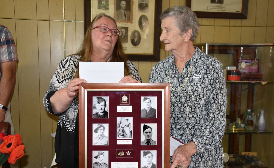 HISTORY: Guyra & District Historical Museum president Martha Weiderman and Nancy Herford with one of the museum's latest acquisitions, in April. Photo: Nicholas Fuller