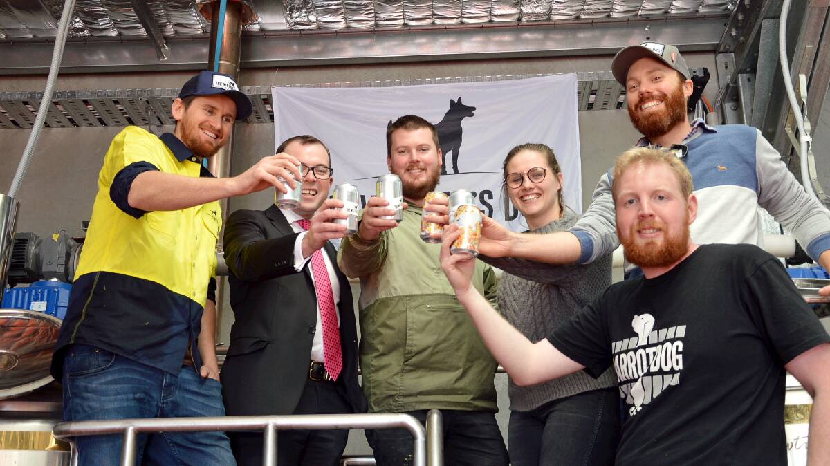 CHEERS FOR ARMIDALE BEERS: Dan Emery, Northern Tablelands MP Adam Marshall, Phil Stevens, Jade Meddemmen, Tom Croft and Dan Coffey (on the stairs).toast the Welder’s Dog brewhouse's heading to the Fine Food Australia expo in Melbourne.