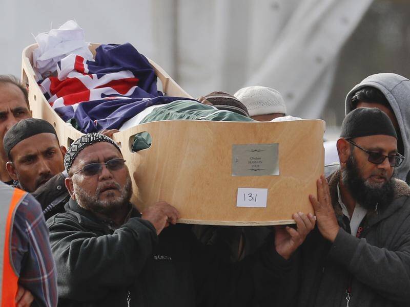 Mourners carry the body of a victim of the Christchurch mosque shootings for a burial.
