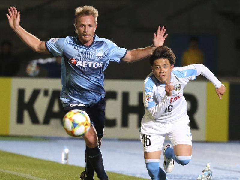 Sydney FC defender Rhyan Grant competes with Frontale's Tatusya Hasegawa during their ACL game.