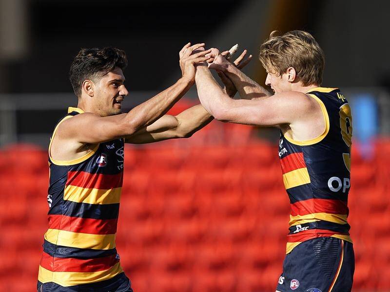 There are fears Adelaide AFL skipper Rory Sloane (R) has a broken hand after the West Coast loss.