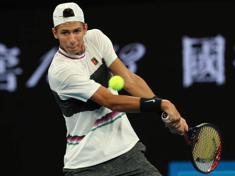 Alexei Popyrin is through to the third round of the Australian Open after Dominic Thiem retired.