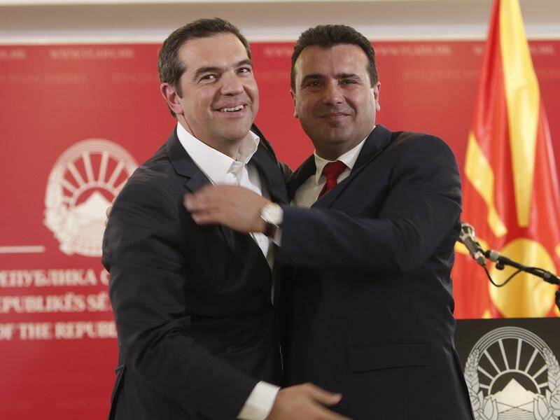 Greece's Alexis Tsipras (l) and North Macedonia's Zoran Zaev have embraced at their historic summit.