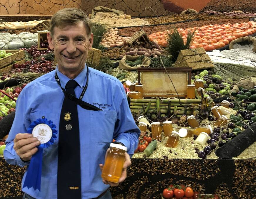 GOOD SHOW: Co-manager of the Northern District Exhibit Sydney Royal Easter Show Brad James with honey from CT & CC Cooper from Tingha.