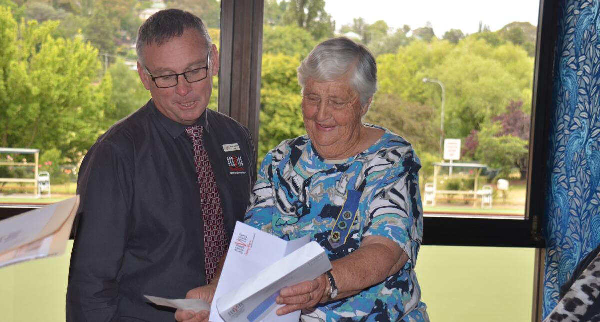DONATION: Armidale Services Club general manager Scott Sullivan hands over the cheque for $3600 to CWA New England treasurer Dorothy Every.