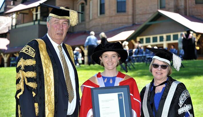 GRADUATION: Dr Joanna Newton, young Distinguished Alumni Award recipient pictured with chancellor James Harris and vice-chancellor Annabelle Duncan at the 2018 Spring graduation ceremony. 
