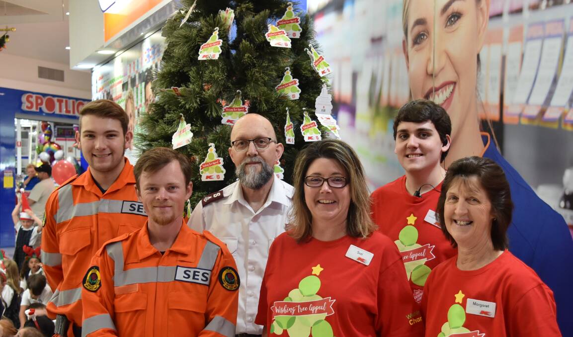 LAUNCH: Armidale's 2018 Kmart Christmas Tree Appeal began on Monday morning with (l-r) SES volunteers Jock Campbell and Edward Ryan, Major Peter Spindler, store manager Suzi Evans, Mitch Green and Margaret McLeal teaming up to give this year's event a big chance of success.