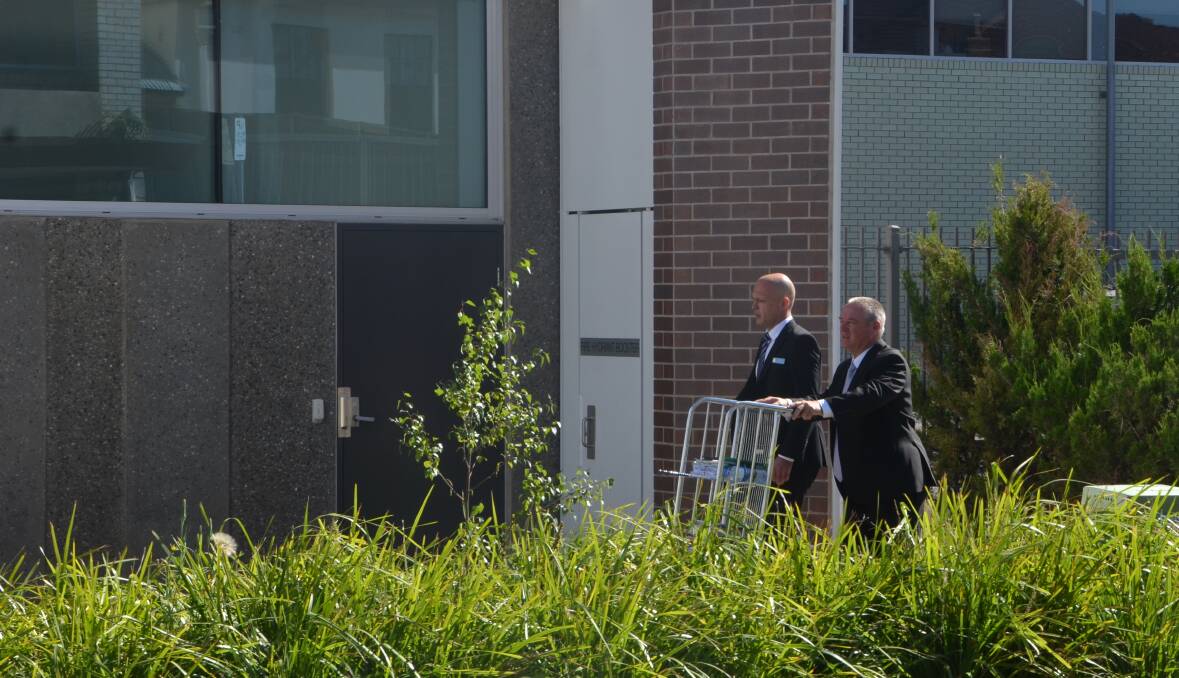 SEX ARREST: A New England detective and prosecutor, pictured arriving at Armidale Local Court on Wednesday, ahead of the hearing to suppress details of the case against the suspended staff member. Photo: Armidale Express